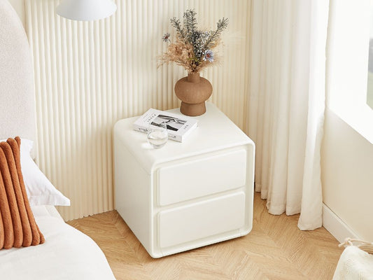 Oak bedside table styled in a small Lifely bedroom